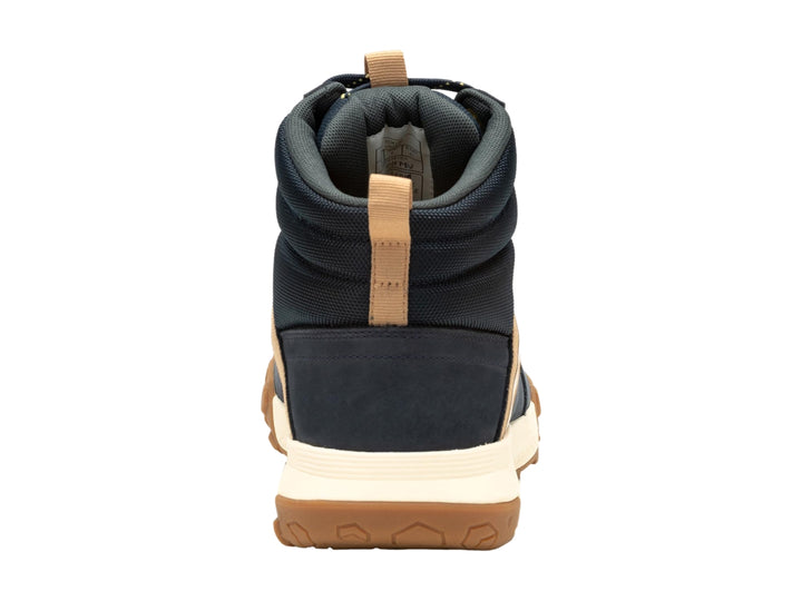 Bota Caterpillar azul oscuro con detalles en café y suela blanca y café para hombre.