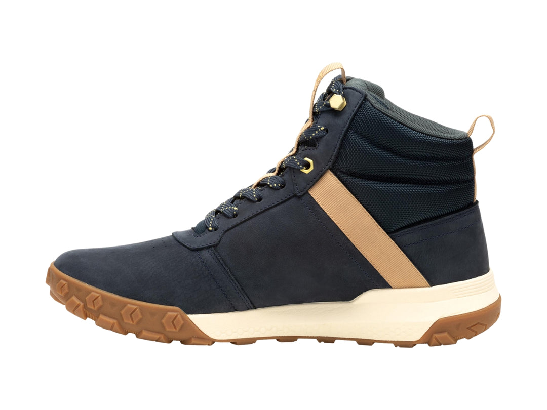 Bota Caterpillar azul oscuro con detalles en café y suela blanca y café para hombre.