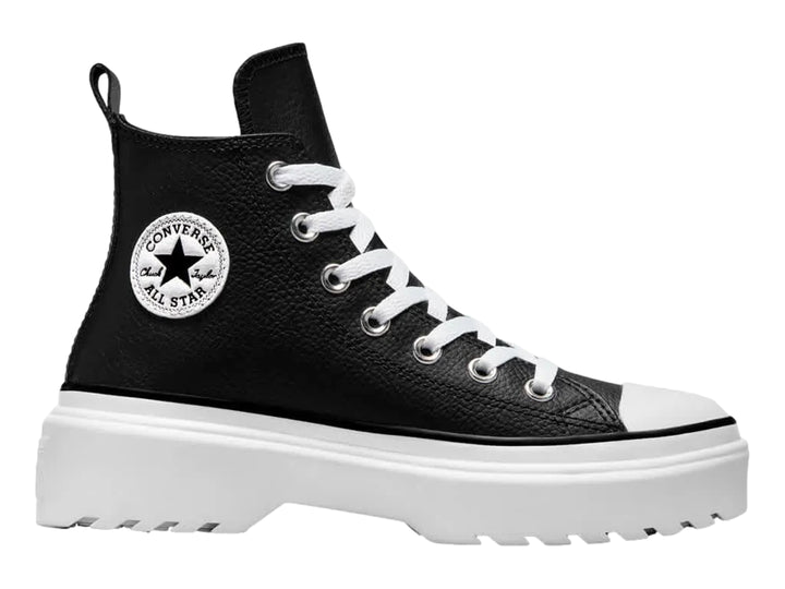 Tenis Converse Chuck Taylor All Star de cuero negro con suela de plataforma blanca gruesa.