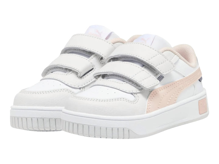 Tenis PUMA blancos para niña con franja rosa y cierre de velcro.