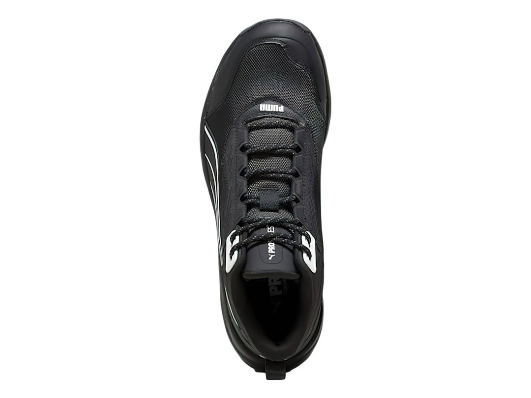 Tenis deportivos PUMA de corte medio en color negro con detalles en blanco y suela robusta.