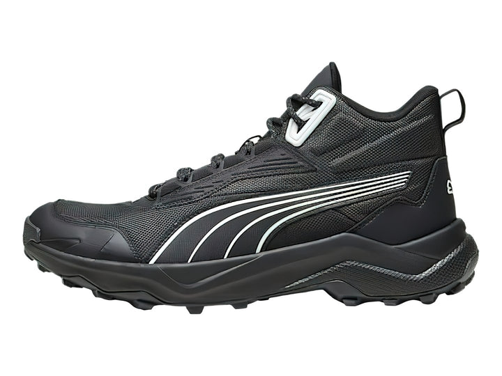 Tenis deportivos PUMA de corte medio en color negro con detalles en blanco y suela robusta.