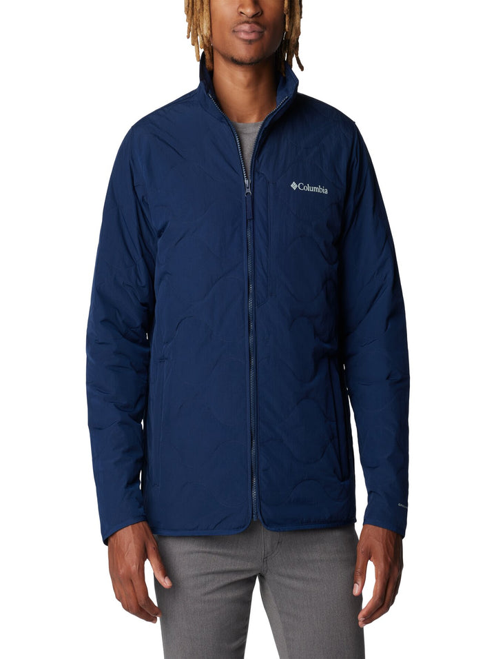 Chaqueta acolchada de color azul marino marca Columbia con cierre frontal.