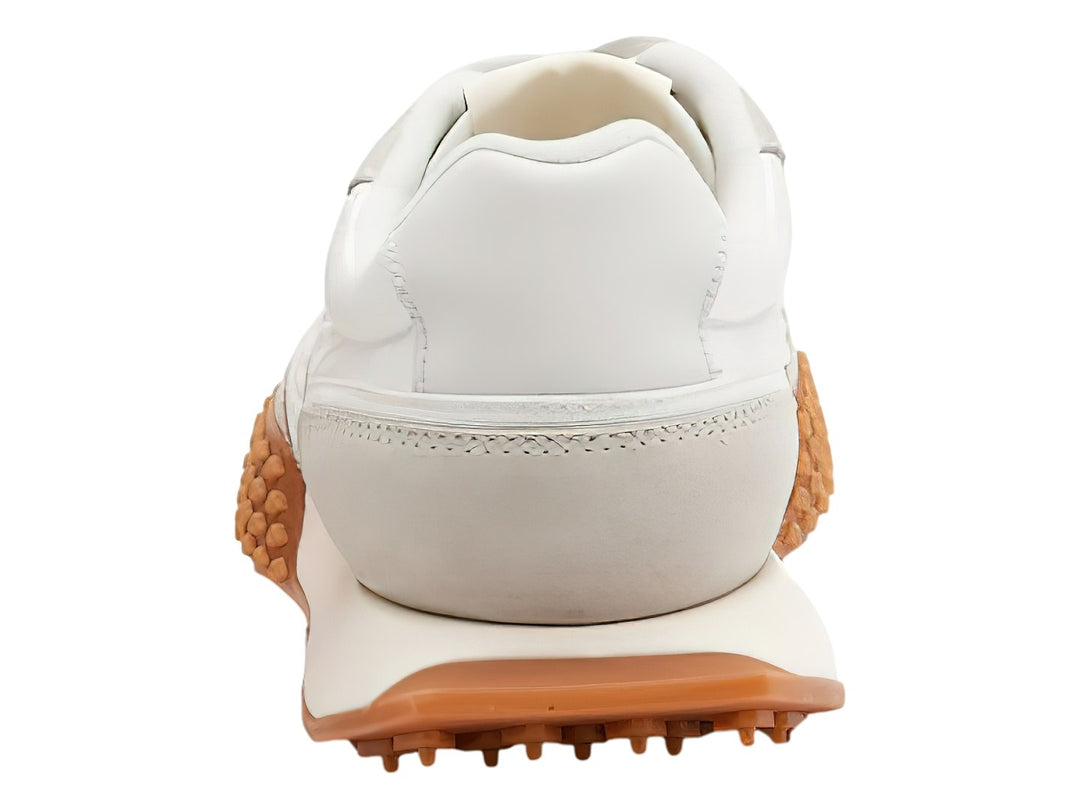 Tenis Lacoste L-Spin Deluxe color blanco con suela marrón de textura dentada.