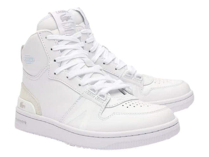 Tenis Lacoste mid-top color blanco con detalles en beige y suela blanca.