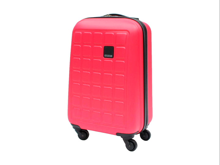 Maleta de equipaje rígida Samsonite color rosa claro con ruedas spinner y diseño de relieve cuadrado.