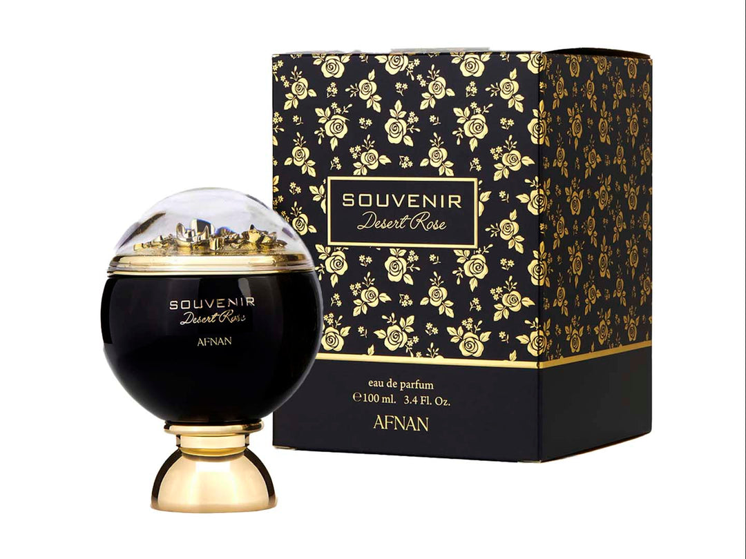 Perfume Afnan Souvenir Desert Rose en frasco negro y dorado con caja negra decorada con rosas doradas.