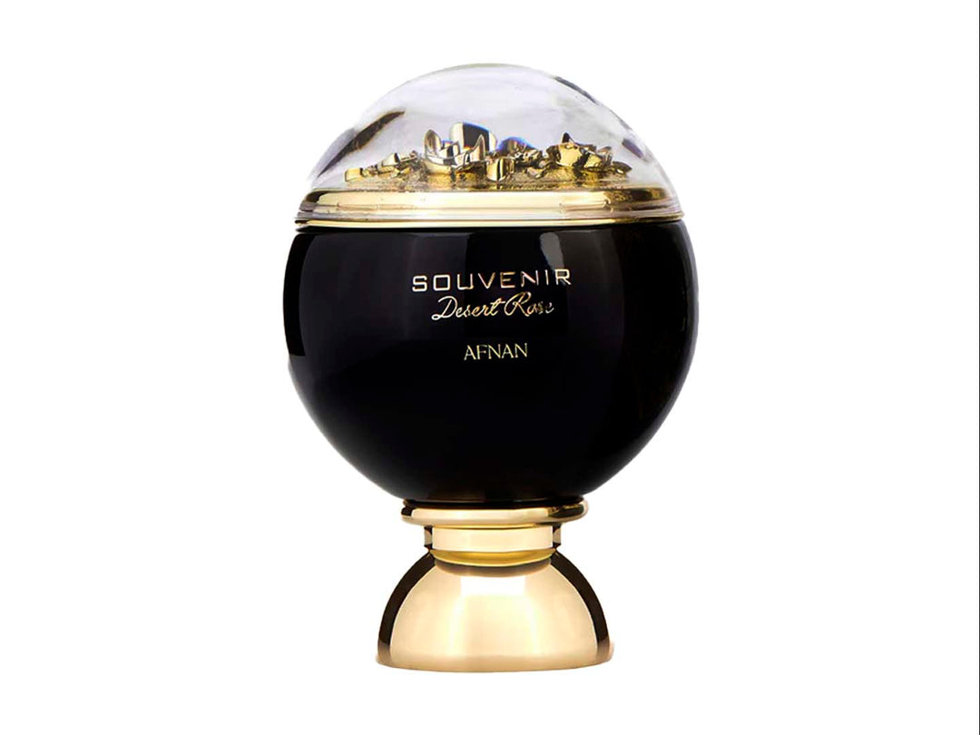 Perfume Afnan Souvenir Desert Rose en frasco negro y dorado con caja negra decorada con rosas doradas.