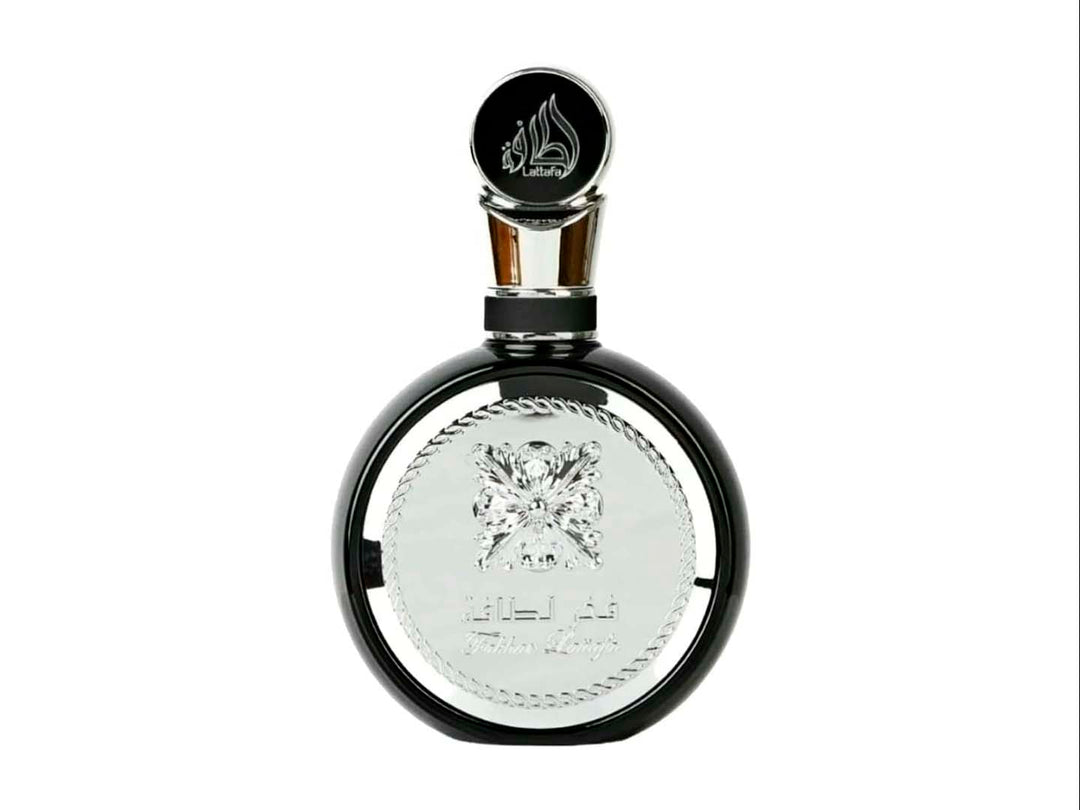 Perfume Lattafa Fakhar Men en botella blanca y negra con su caja decorada en blanco y negro.