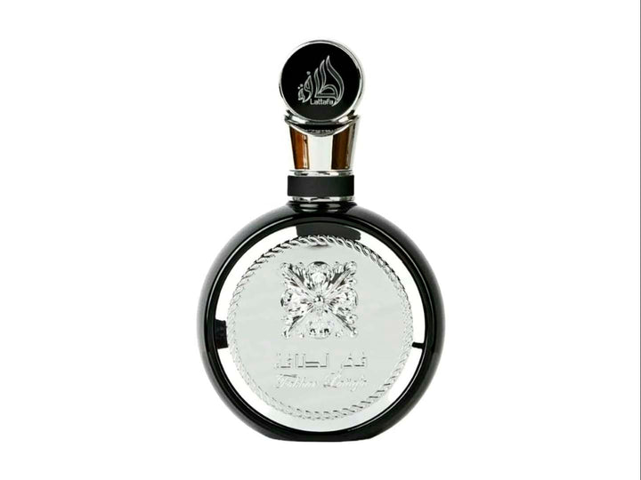 Perfume Lattafa Fakhar Men en botella blanca y negra con su caja decorada en blanco y negro.