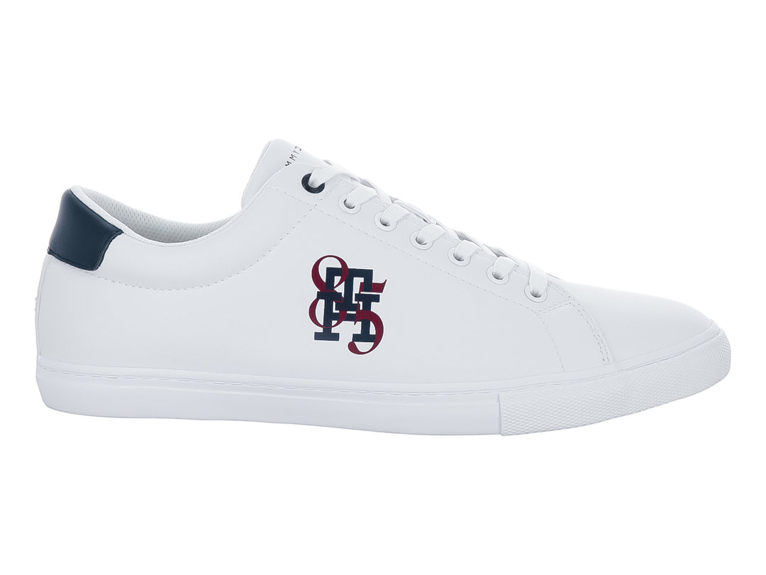Tenis blancos de Tommy Hilfiger con talón azul marino y logotipo lateral en rojo y azul.