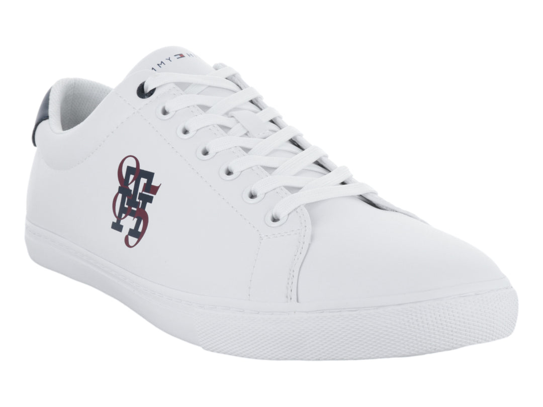 Tenis blancos de Tommy Hilfiger con talón azul marino y logotipo lateral en rojo y azul.