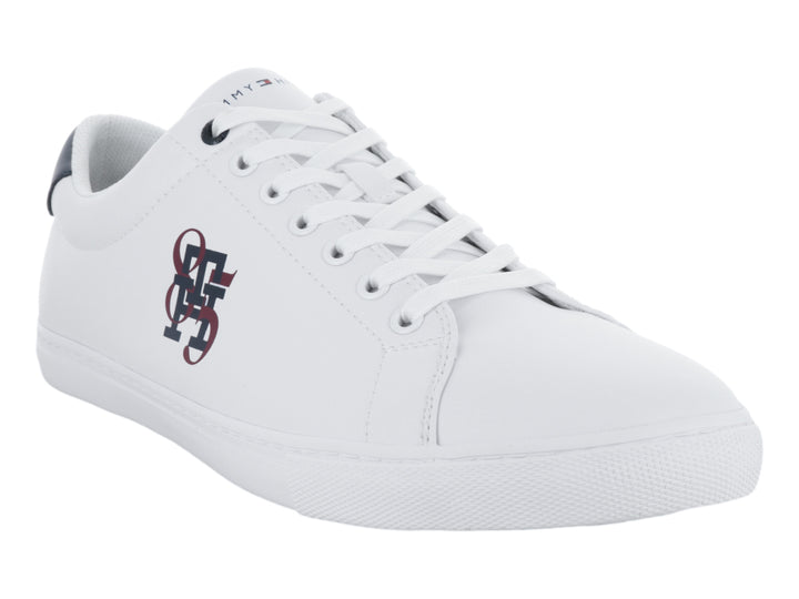 Tenis blancos de Tommy Hilfiger con talón azul marino y logotipo lateral en rojo y azul.