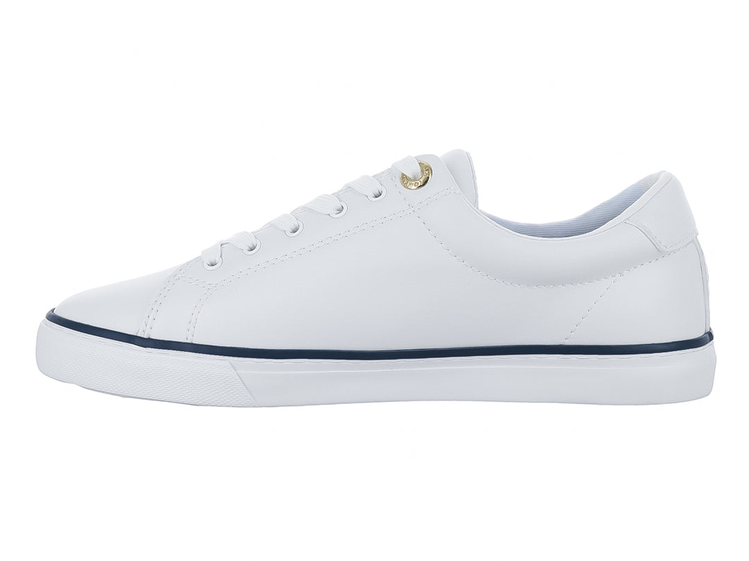 Tenis blancos Tommy Hilfiger con detalles en azul marino y texto Hilfiger 85 en el lateral.