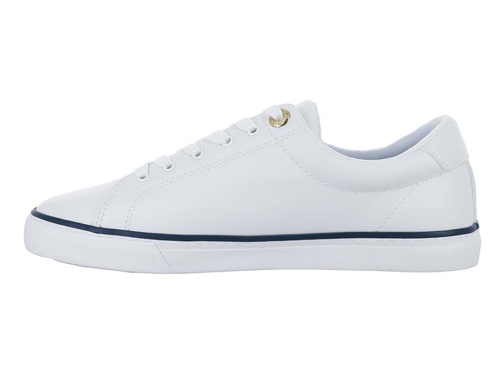 Tenis blancos Tommy Hilfiger con detalles en azul marino y texto Hilfiger 85 en el lateral.