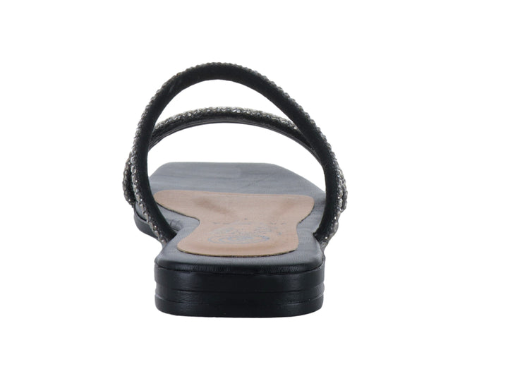 Sandalia plana color negro para mujer con tiras decoradas con pedrería plateada brillante.