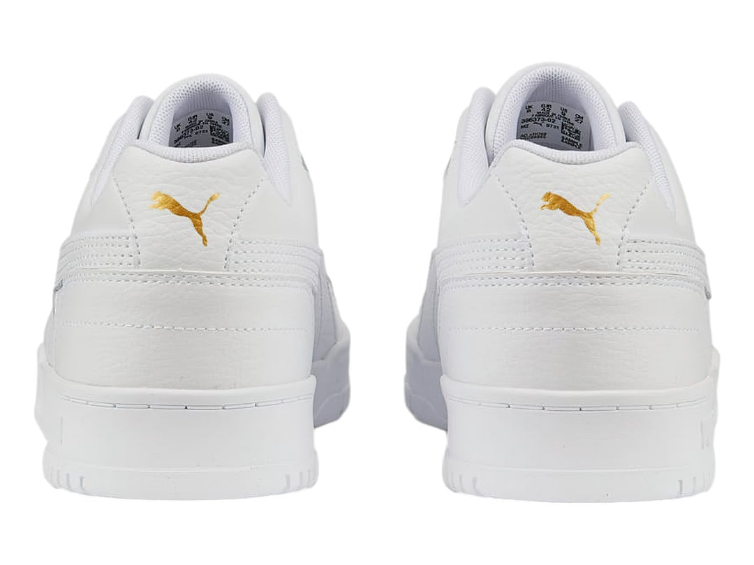 Tenis PUMA RBD Game Low en color blanco total, diseño deportivo de corte bajo con cordones.