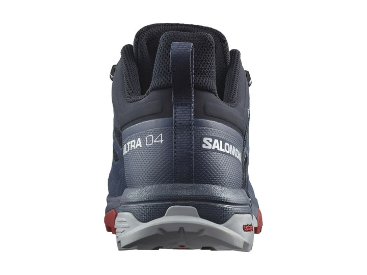 Zapato de senderismo Salomon X Ultra 4 GTX en color azul marino con detalles en gris y rojo.
