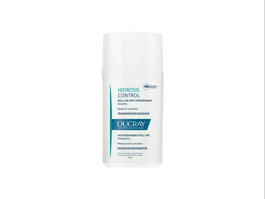 Desodorante antitranspirante Ducray Hidrosis Control en envase roll-on blanco con detalles en azul.