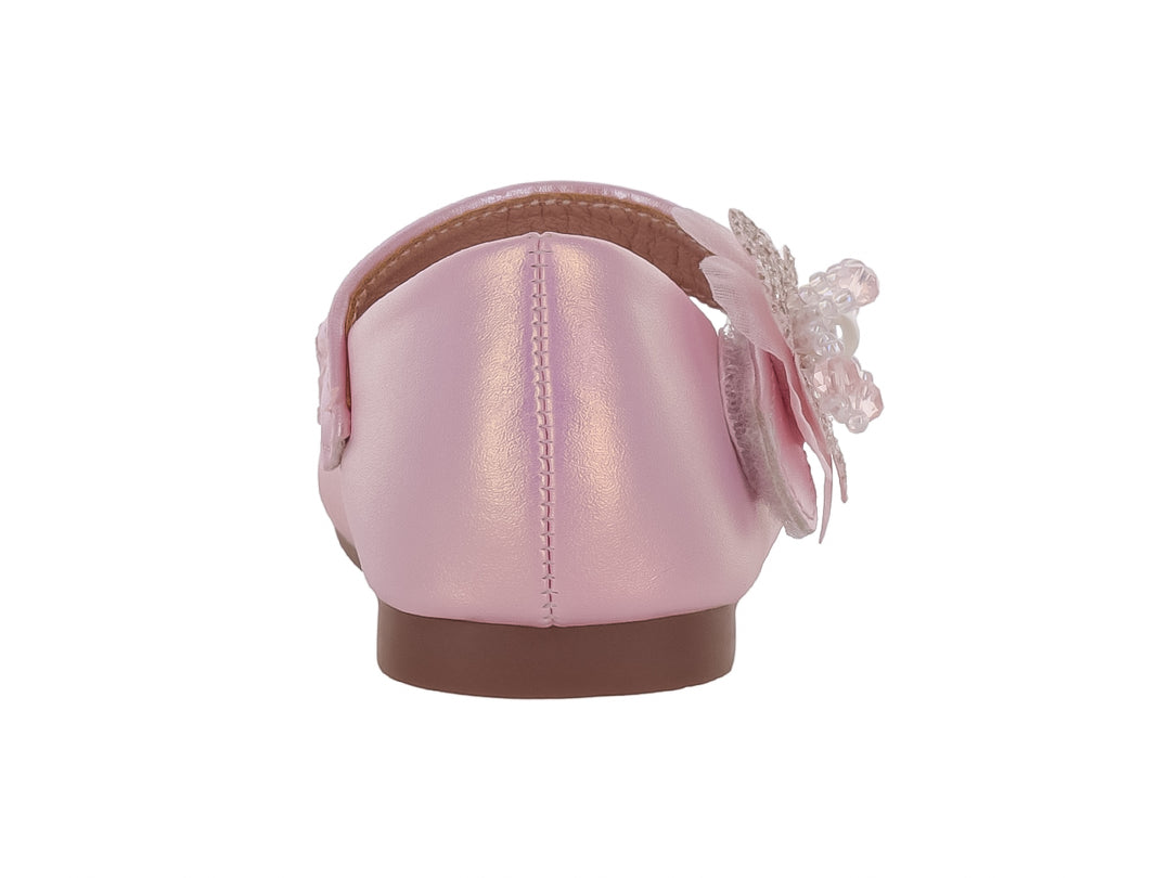 Zapato plano rosa brillante para niña con adorno de flor y perla.