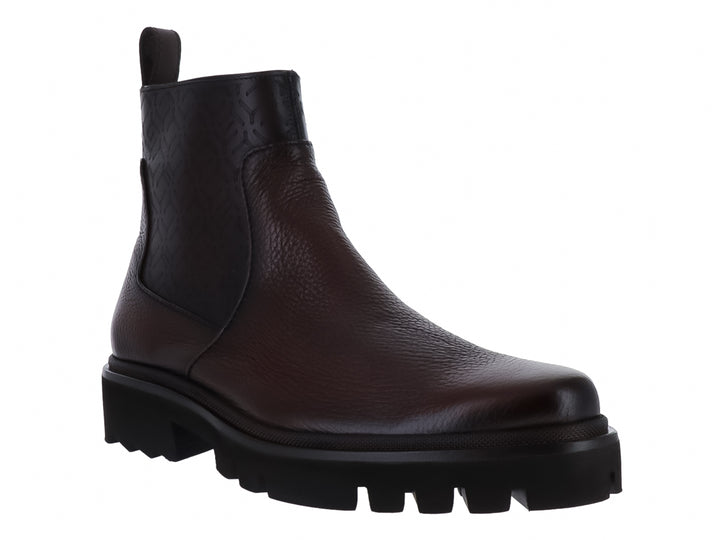 Bota de cuero color nuez con suela negra gruesa y dentada, diseño casual para Hombre.