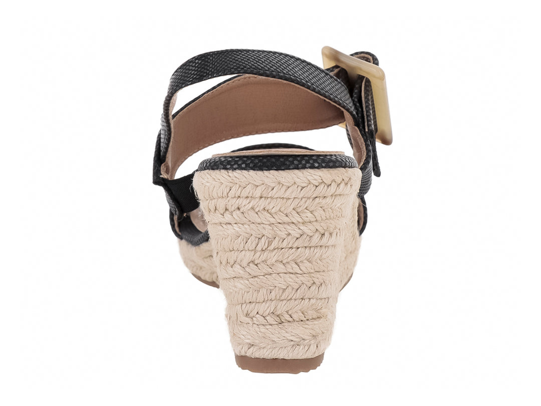 Sandalia de plataforma cuña color negro con correa ajustable y base tejida en tono beige para mujer.
