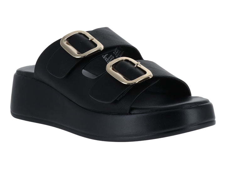 Sandalias negras de plataforma con dos hebillas doradas.