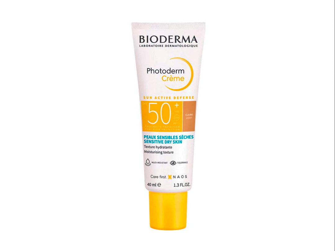 Tubo de crema facial Bioderma Photoderm Crème SPF 50+ en color blanco con detalles y tapa amarilla.