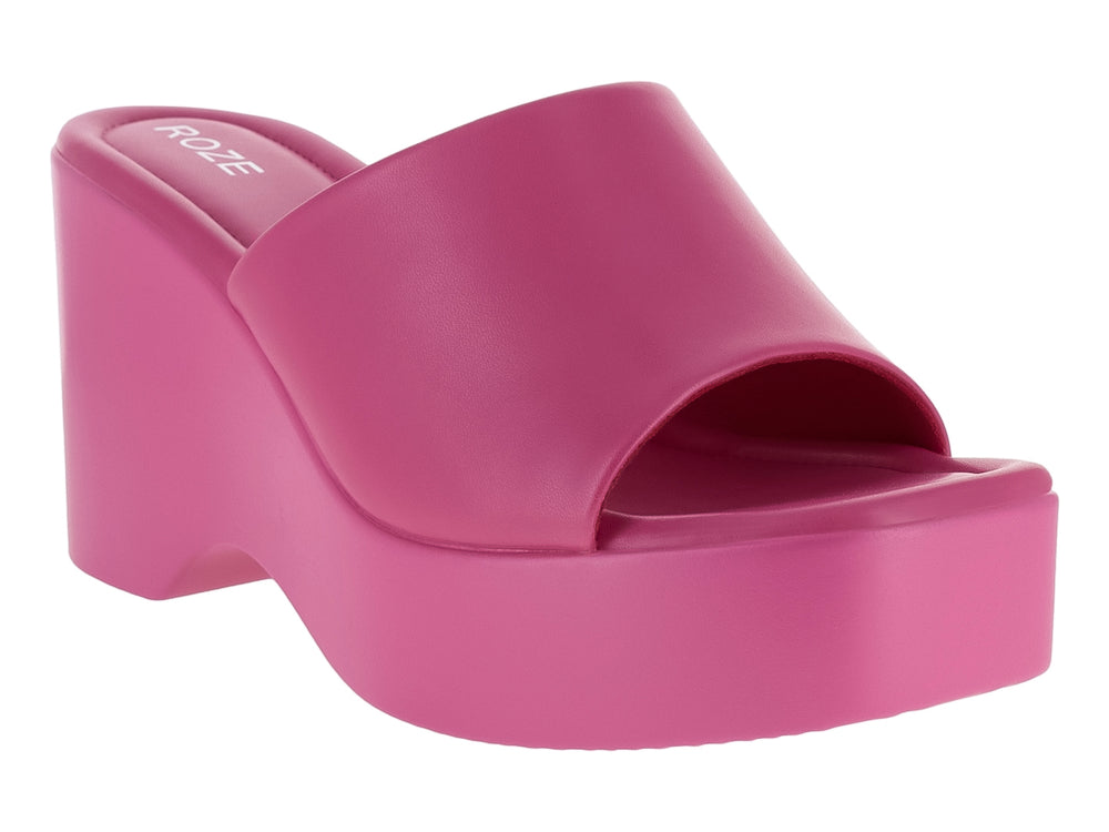 Sandalia de plataforma color fucsia con diseño slide y suela gruesa.