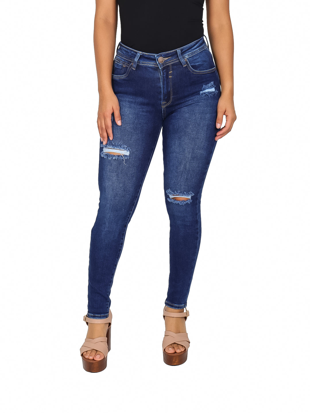 Jeans ajustados para mujer en color azul oscuro con roturas decorativas en las rodillas.