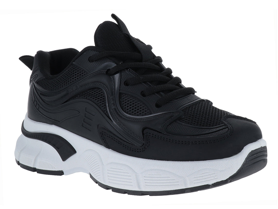 Tenis deportivos ATOK en color negro con suela blanca gruesa y detalles sintéticos.