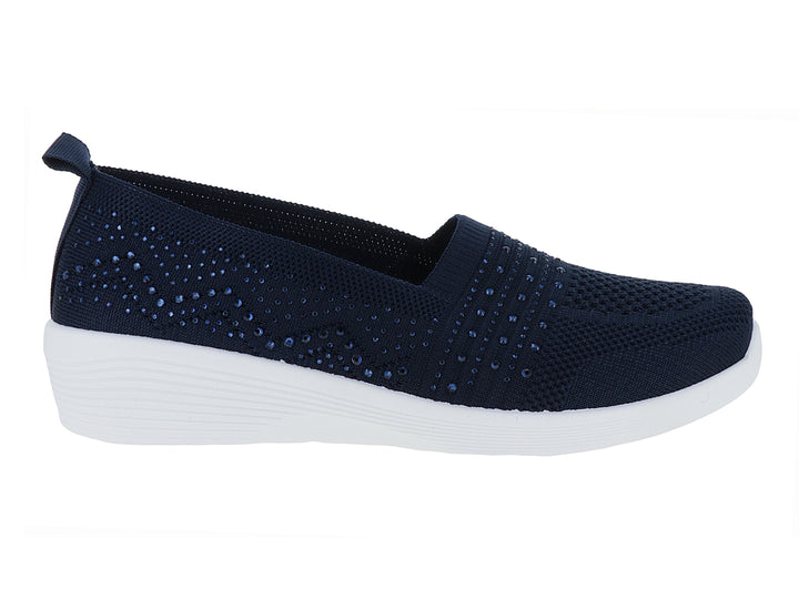 Zapato deportivo slip-on color azul marino con detalles brillantes y suela blanca.