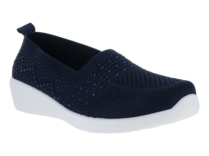 Zapato deportivo slip-on color azul marino con detalles brillantes y suela blanca.