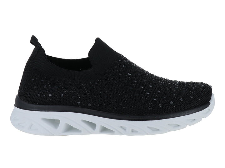 Tenis deportivos ATOK color negro con suela blanca gruesa y diseño sin cordones en tejido transpirable.
