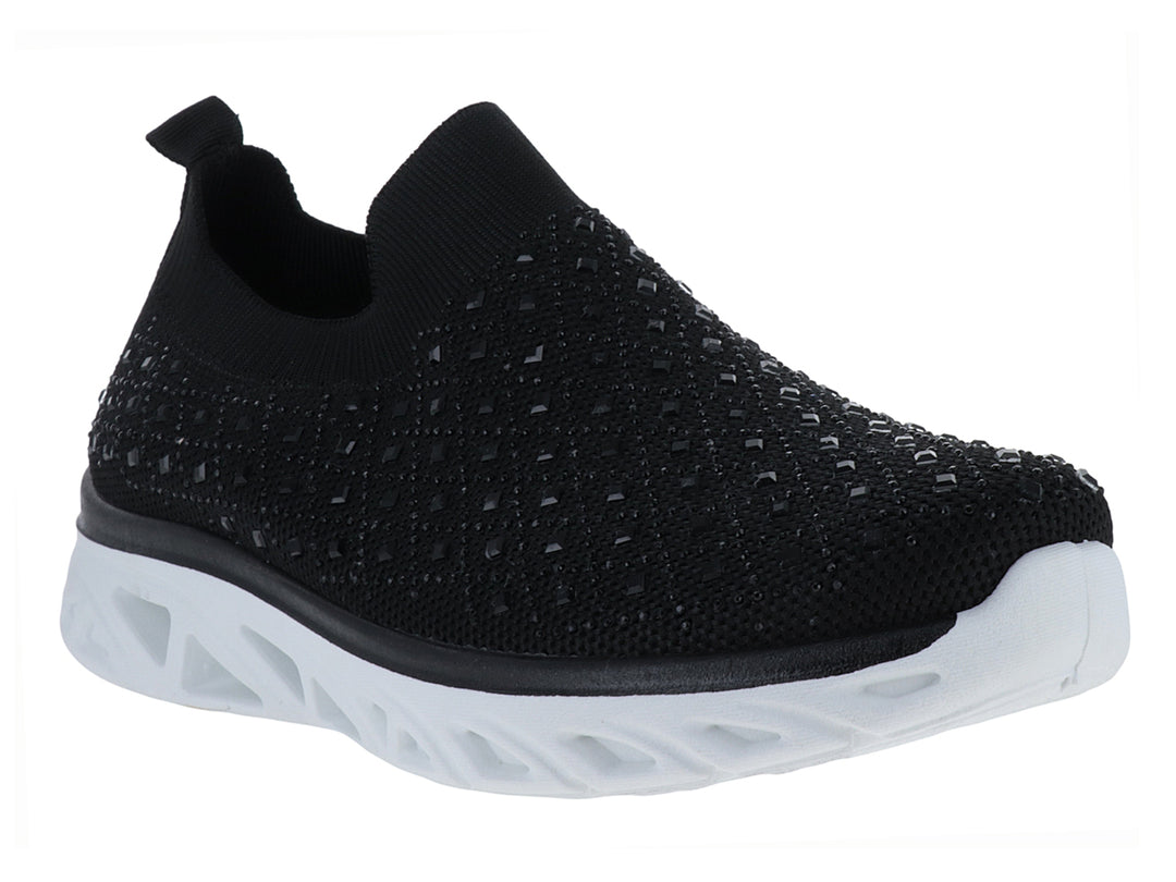 Tenis deportivos ATOK color negro con suela blanca gruesa y diseño sin cordones en tejido transpirable.