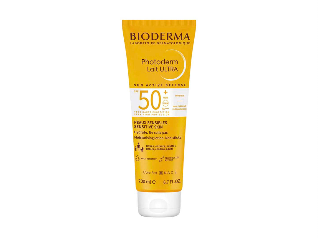 Tubo amarillo de protector solar Bioderma Photoderm Lait ULTRA SPF 50+ de 200 ml.