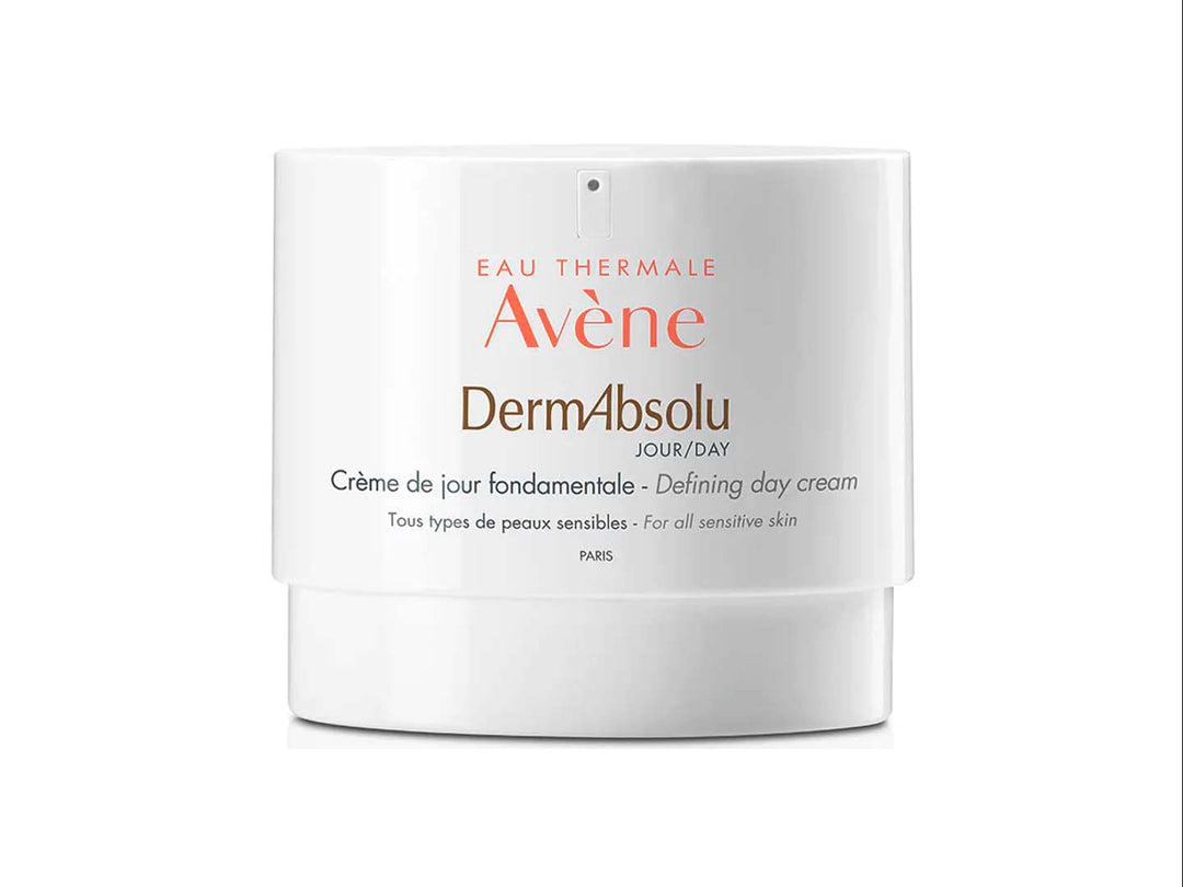 Envase blanco cilíndrico de crema de día redensificante DermAbsolu de Avène para pieles sensibles.
