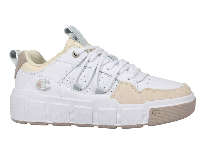 Tenis Champion color blanco con detalles en beige y suela de plataforma blanca.