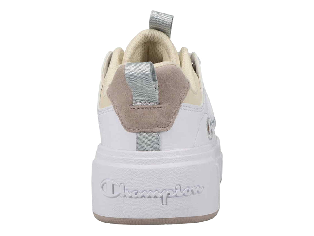 Tenis Champion color blanco con detalles en beige y suela de plataforma blanca.