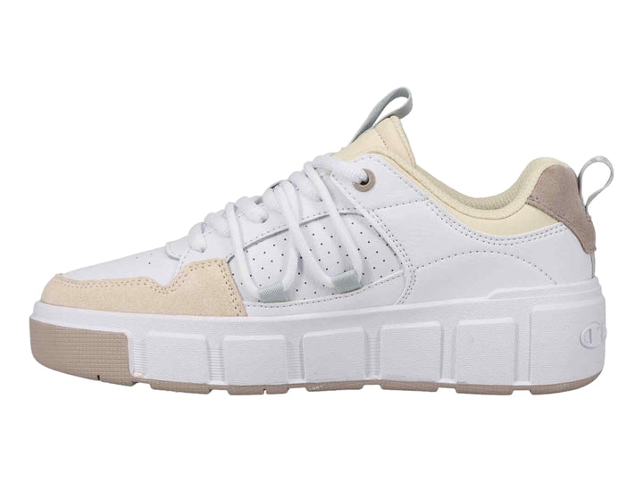 Tenis Champion color blanco con detalles en beige y suela de plataforma blanca.
