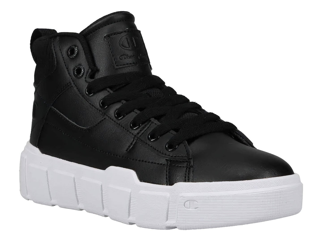 Tenis Champion de bota color negro con suela blanca ancha y plataforma.