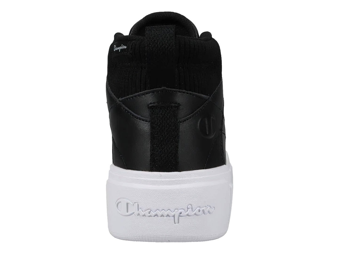 Tenis Champion de bota color negro con suela blanca ancha y plataforma.