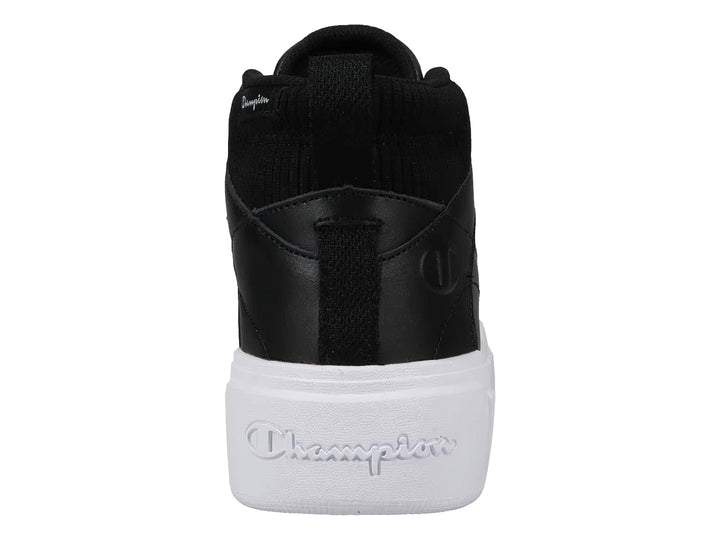 Tenis Champion de bota color negro con suela blanca ancha y plataforma.