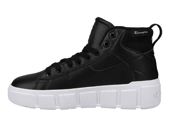 Tenis Champion de bota color negro con suela blanca ancha y plataforma.