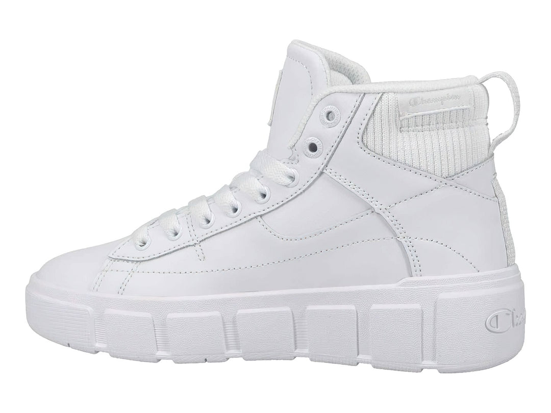 Tenis Champion color blanco, estilo bota alta con suela ancha y plataforma, diseño deportivo casual.