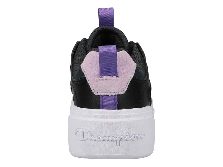 Tenis Champion negros con suela blanca de plataforma y detalles en color lavanda.
