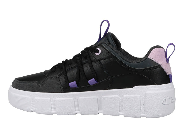 Tenis Champion negros con suela blanca de plataforma y detalles en color lavanda.