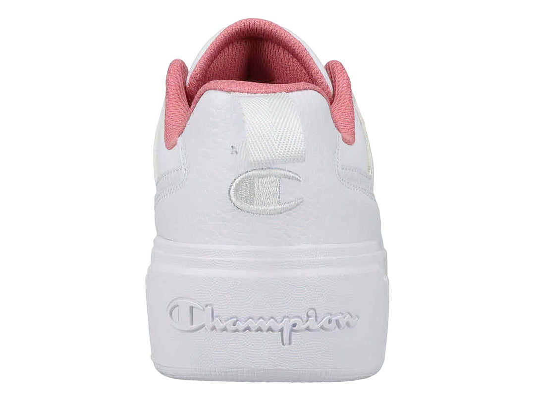 Tenis blancos de plataforma marca Champion con detalles en rosa en el cuello y suela ancha.