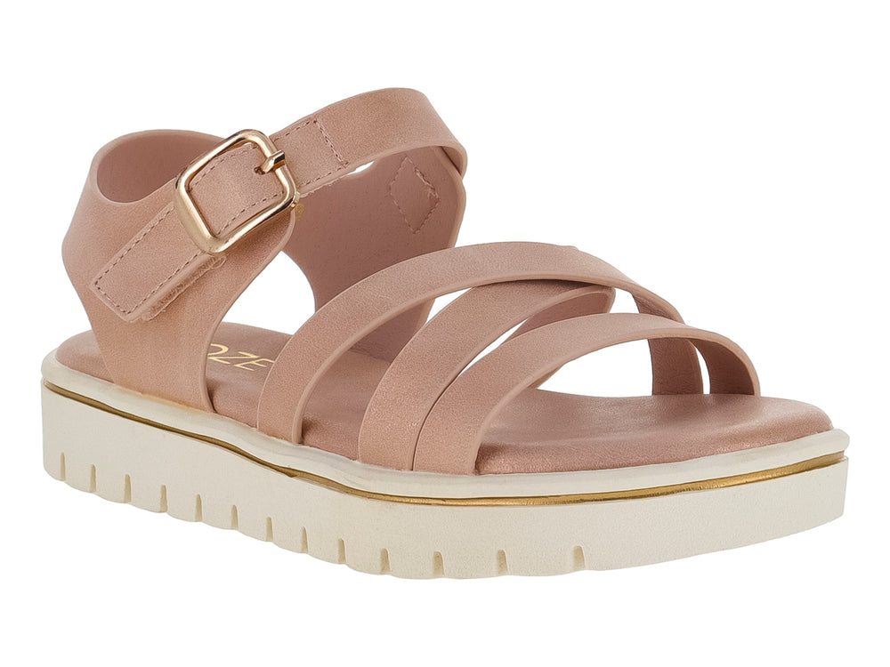 Sandalia color nude para niña con tiras cruzadas, hebilla ajustable y suela blanca de plataforma dentada.