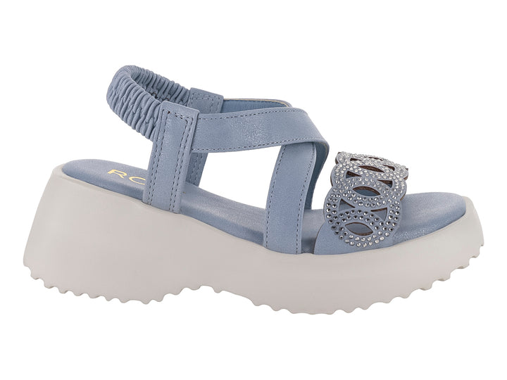 Sandalia azul para niña con suela de plataforma blanca y adorno frontal.